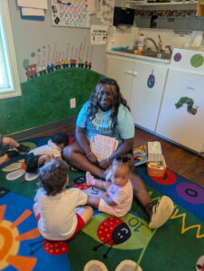Teacher reading to children
