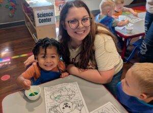 A teacher and student painting